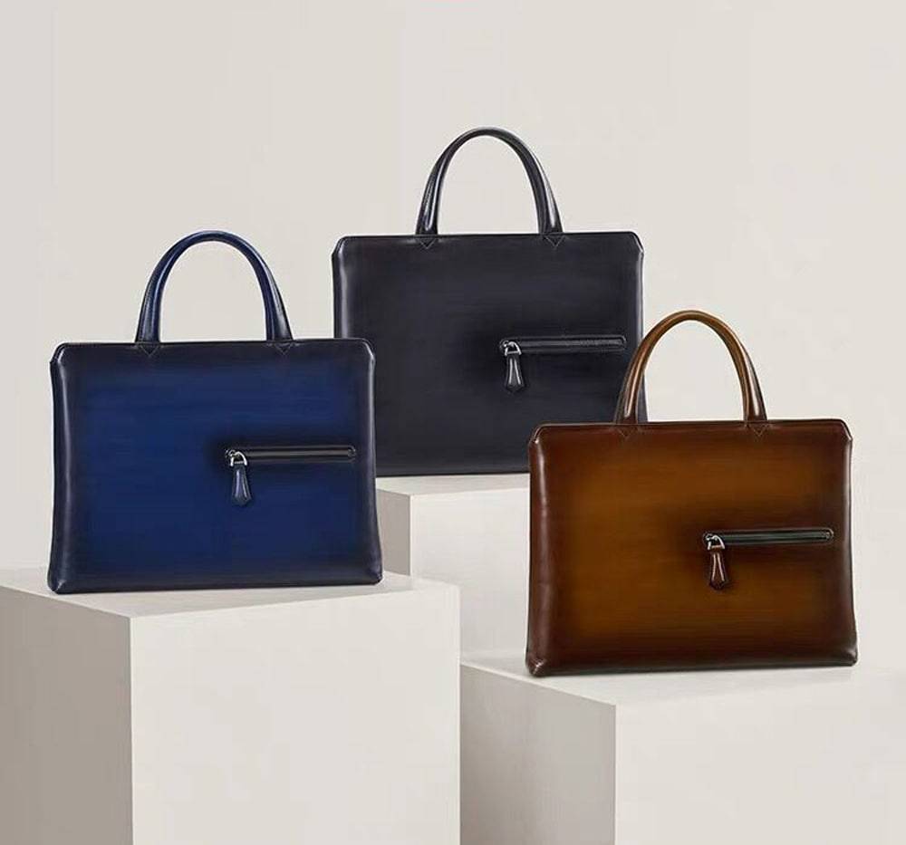 Vintage 15-inch leather laptop briefcase handbag by Rossie Viren, featuring a classic design with sturdy handles and secure zipper closure.