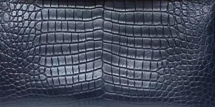 Dark blue genuine crocodile leather briefcase by Rossie Viren featuring a structured handbag design and polished finish.