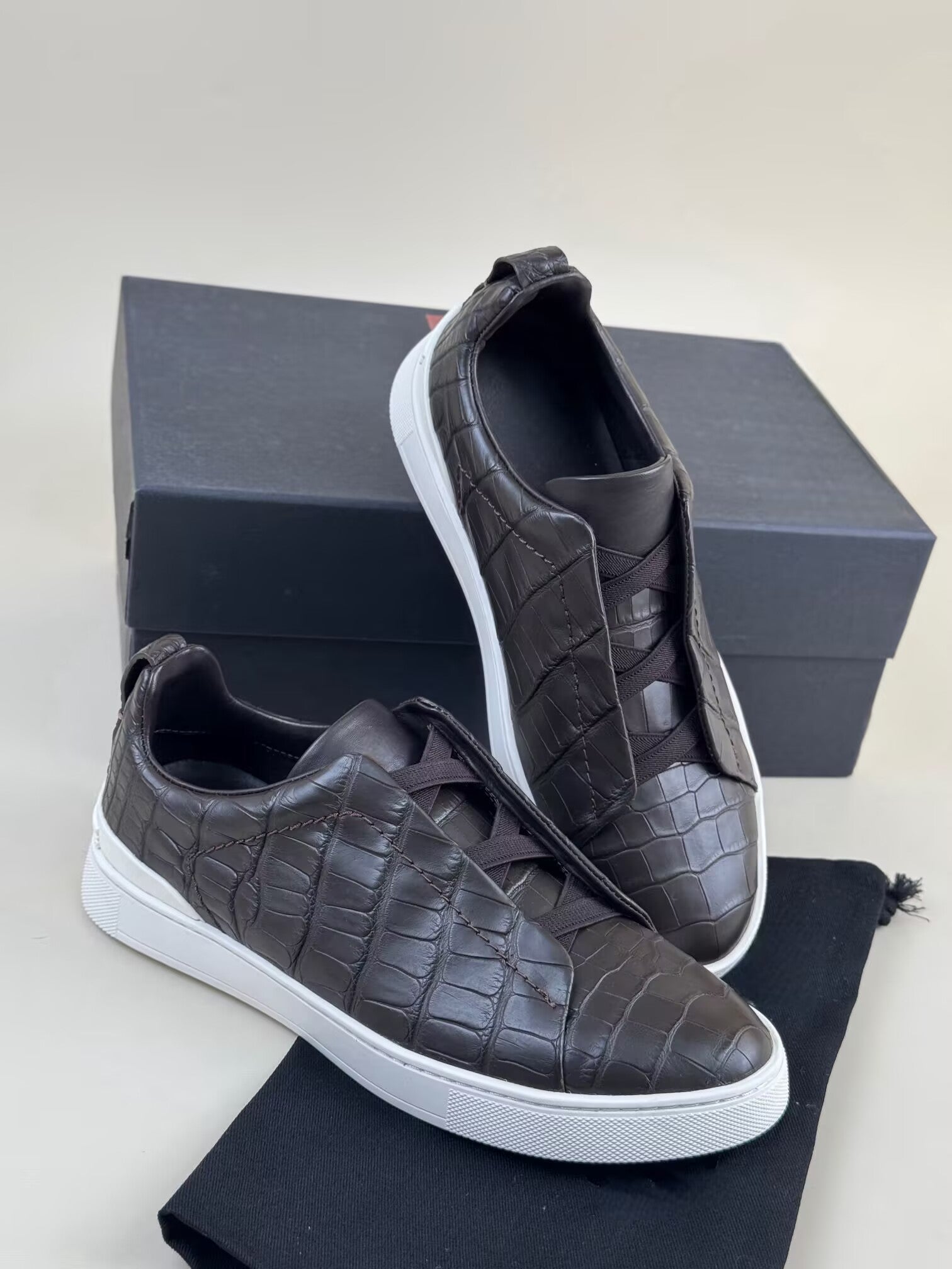 Rossie Viren genuine crocodile skin leather sneakers in brown with detailed crocodile pattern and sleek shoe design.