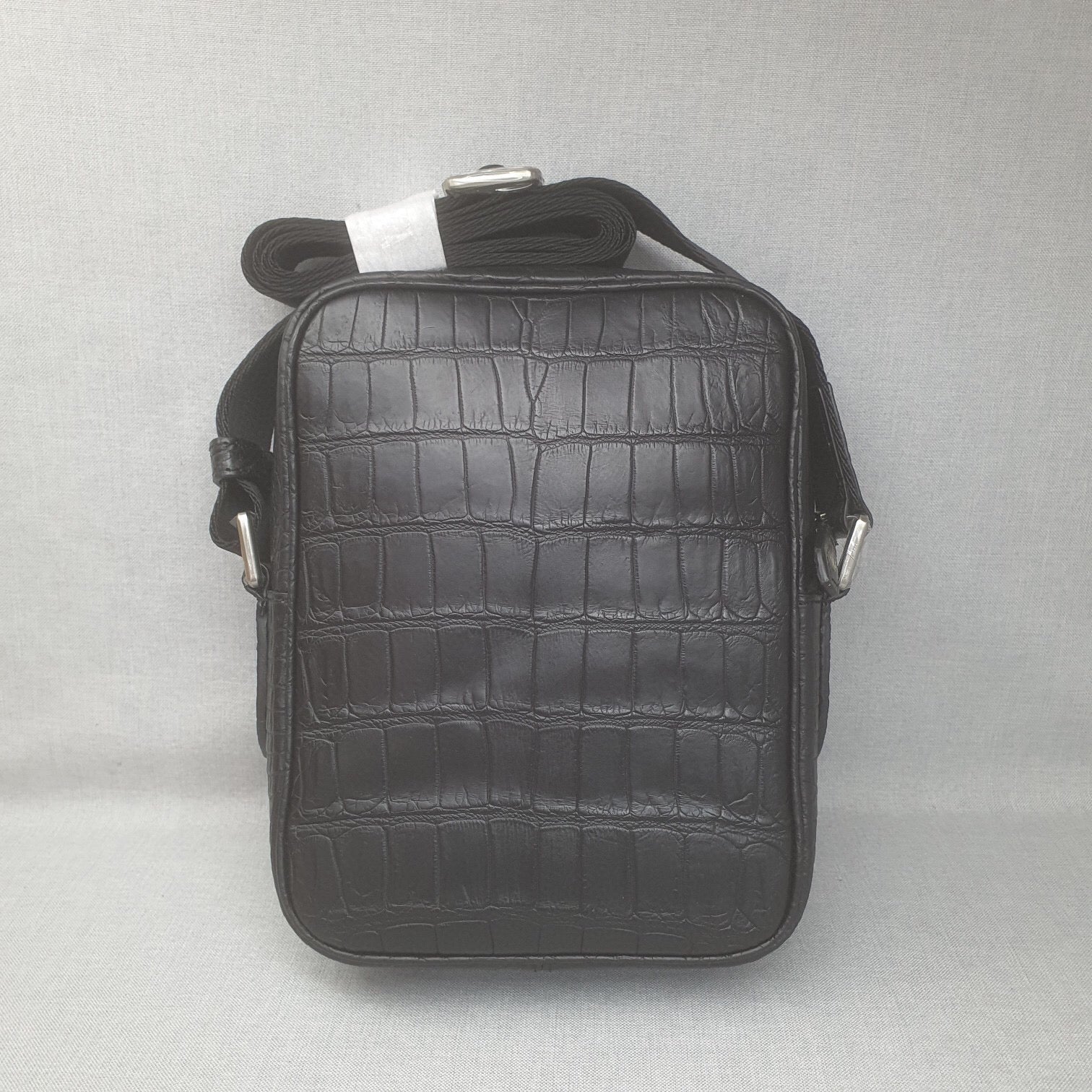 Rossie Viren crocodile leather small crossbody shoulder bag with sleek design and adjustable strap.