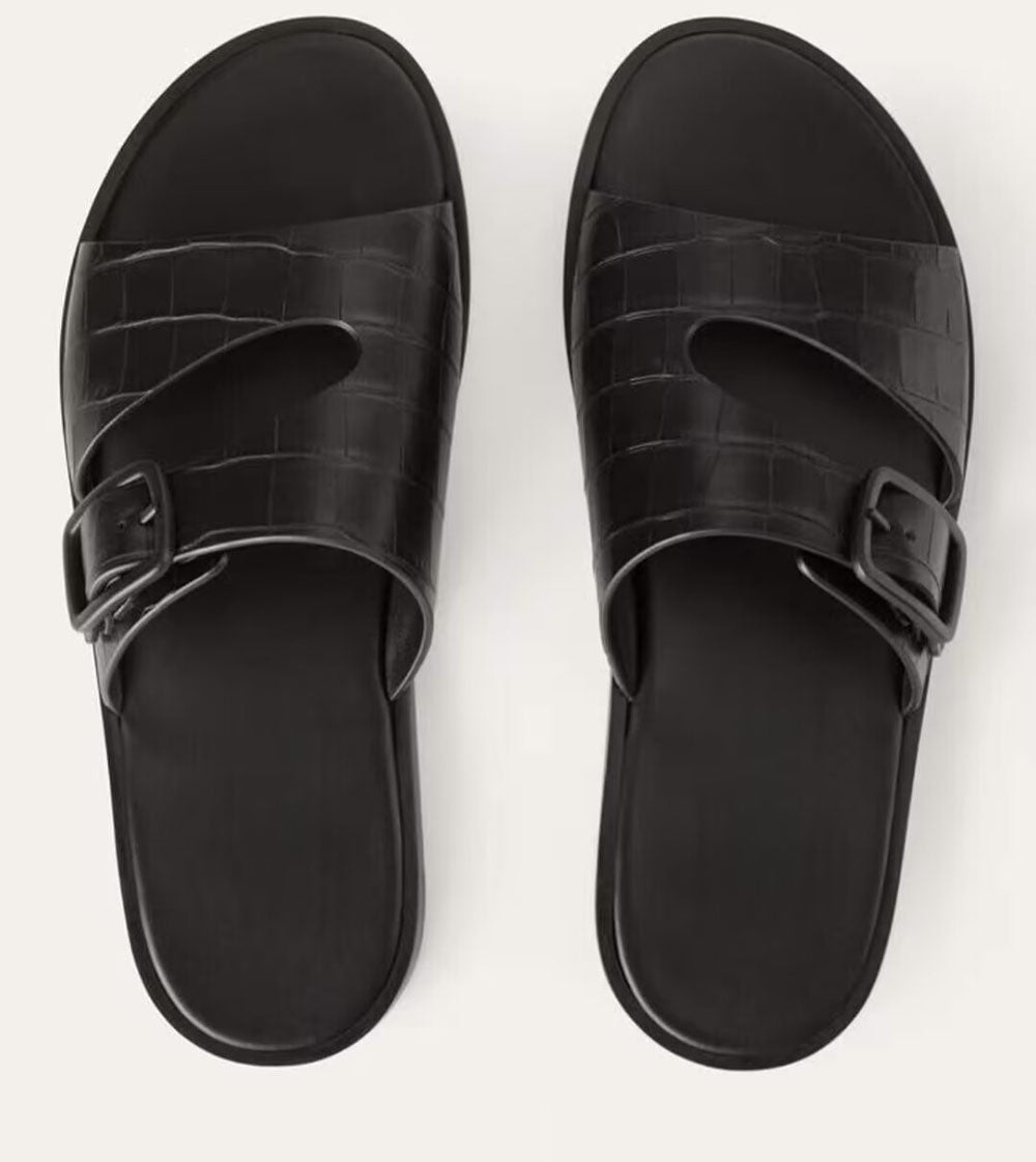 Men's crocodile leather slippers by Rossie Viren, showcasing the textured crocodile pattern and sleek slip-on shoe design.