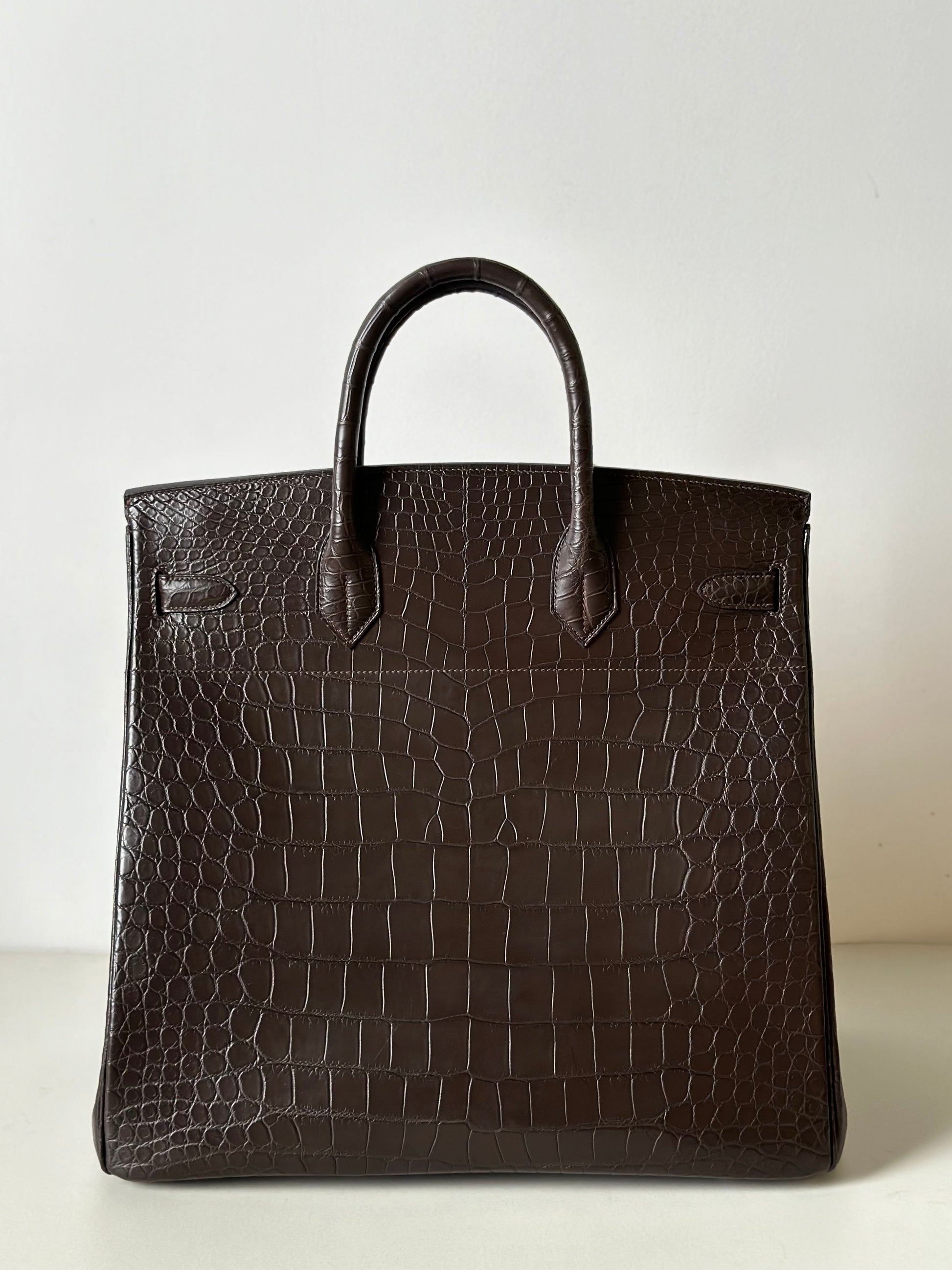 Brown Rossie Viren genuine Nile crocodile skin leather top handle bag with oversized 40cm padlock for business and office use.