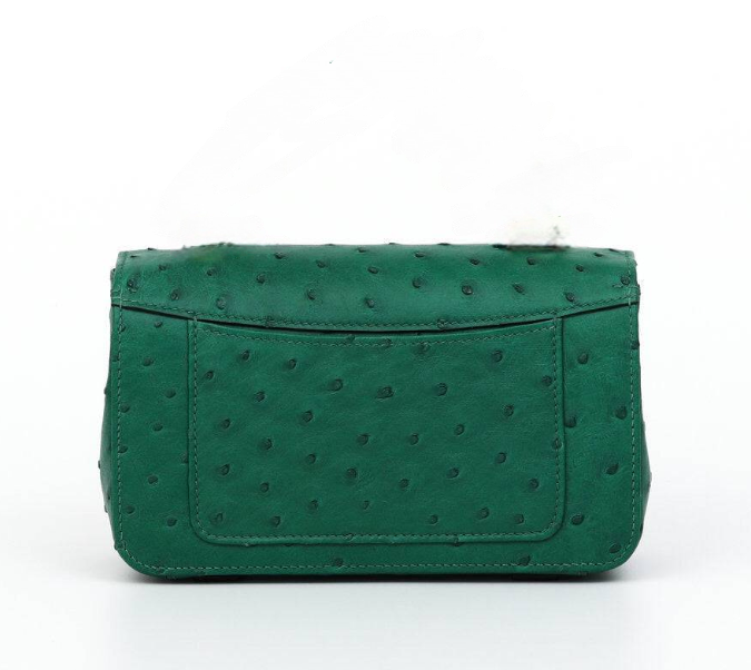 Hot pink Rossie Viren women's crocodile skin leather mini flap chain handbag with top handle and crossbody strap.
