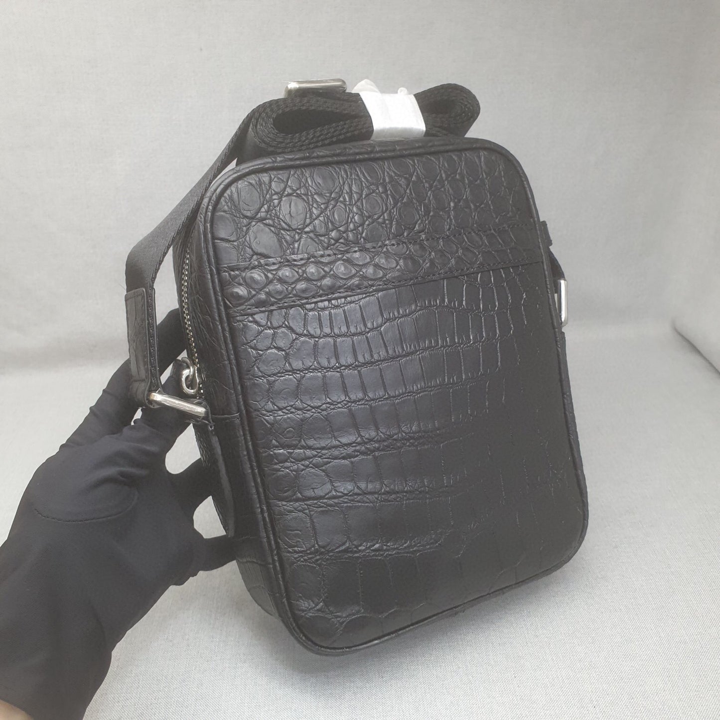 Rossie Viren crocodile leather small crossbody shoulder handbag with a sleek design and adjustable strap.