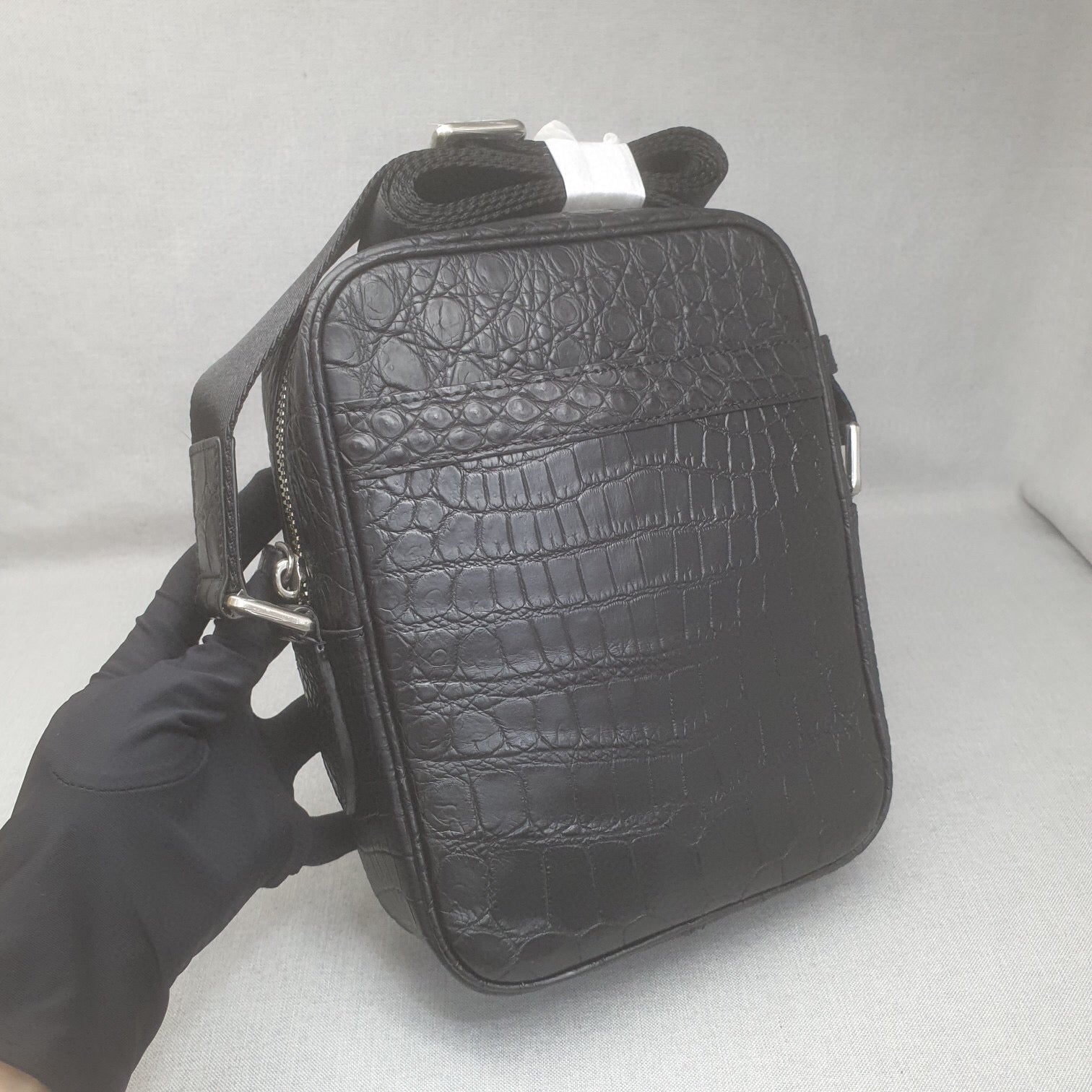 Rossie Viren crocodile leather small crossbody shoulder handbag with a sleek design and adjustable strap.