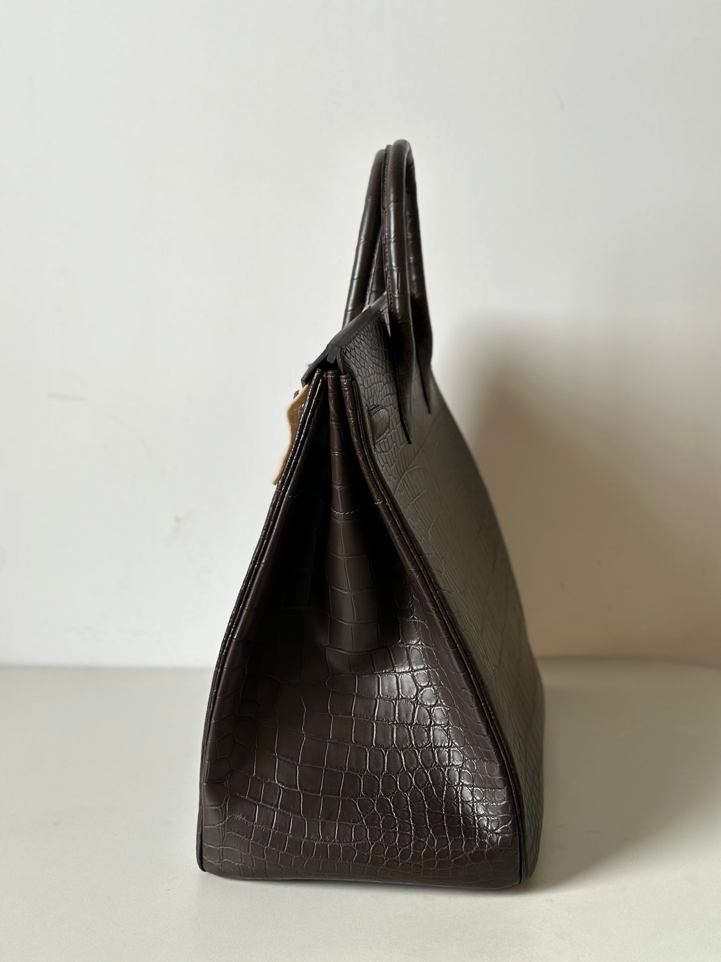 Rossie Viren genuine Nile crocodile leather top handle business handbag in brown with oversized 40cm padlock detail.