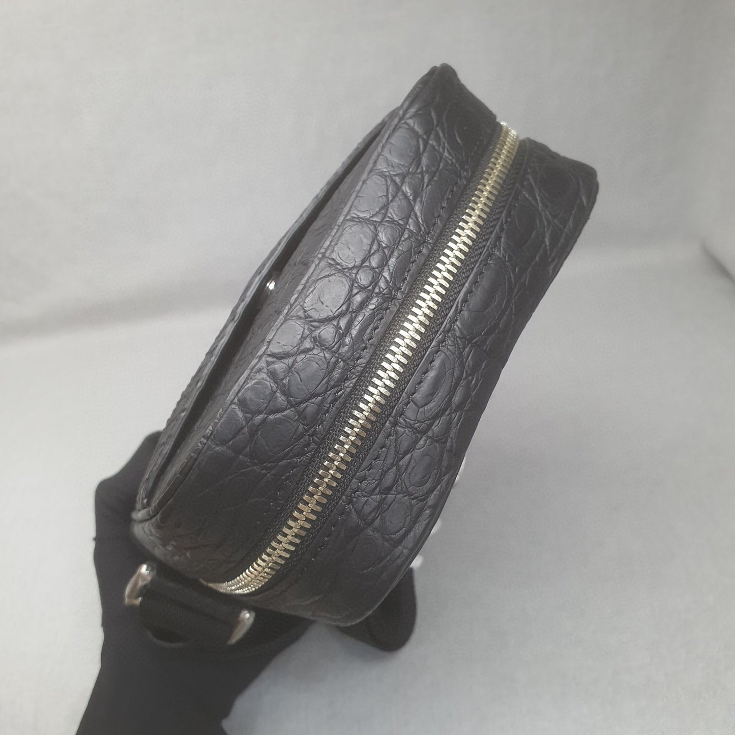 Rossie Viren crocodile leather small crossbody handbag with adjustable shoulder strap and compact design.