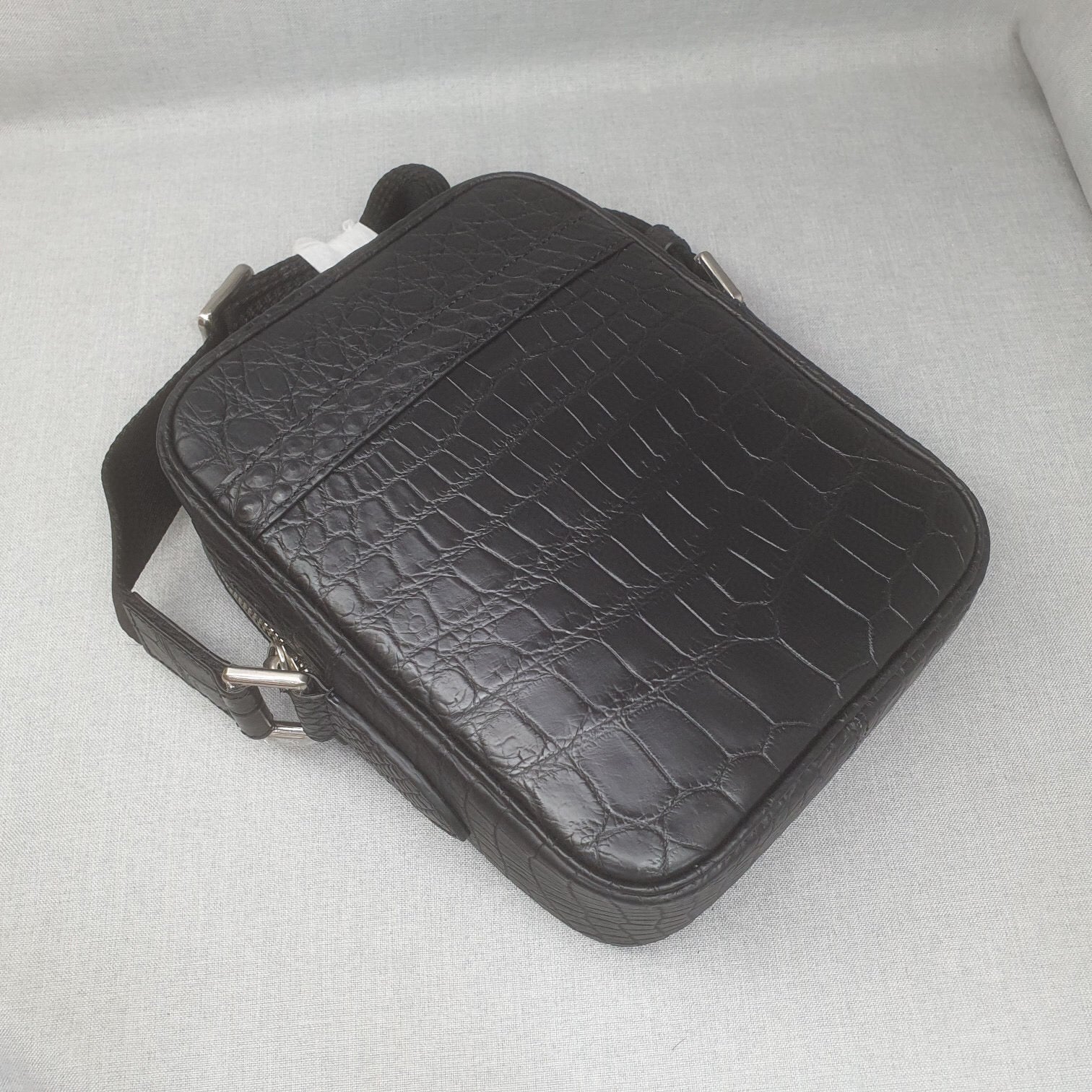Rossie Viren crocodile leather small crossbody handbag with adjustable shoulder strap and sleek design.