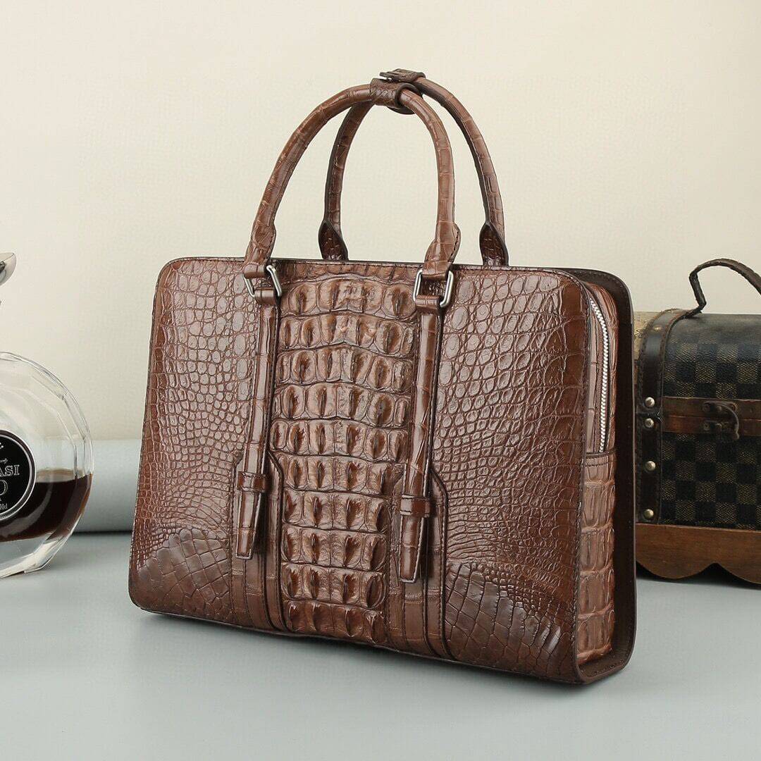 Black and brown crocodile leather Rossie Viren handbag with structured shape and top handle, showcasing luxury craftsmanship.