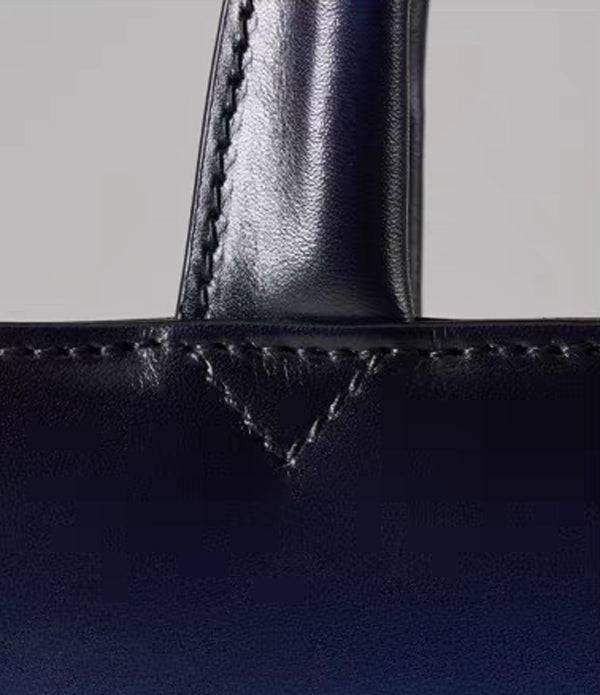 Vintage 15-inch leather laptop briefcase handbag by Rossie Viren with sturdy handles and classic design.