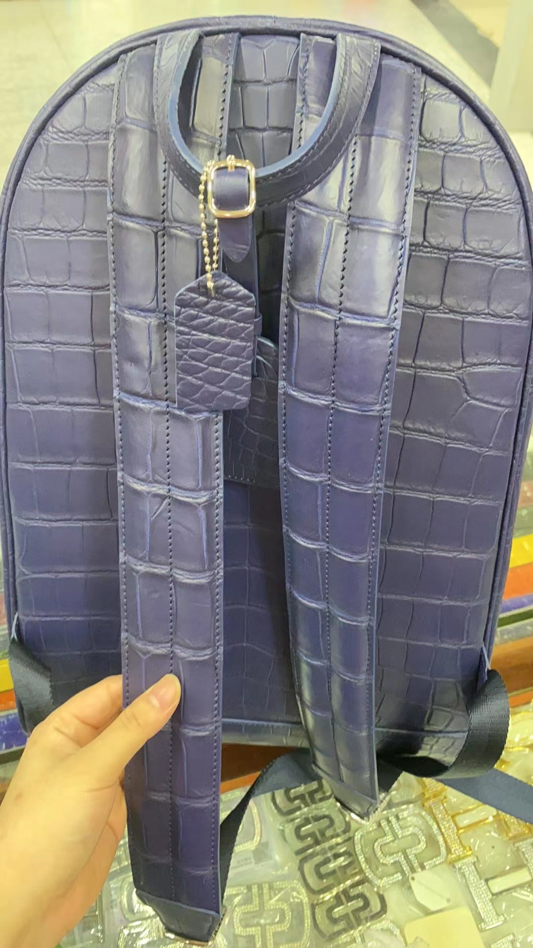 Large black crocodile leather backpack by Rossie Viren, featuring textured crocodile pattern and spacious design.