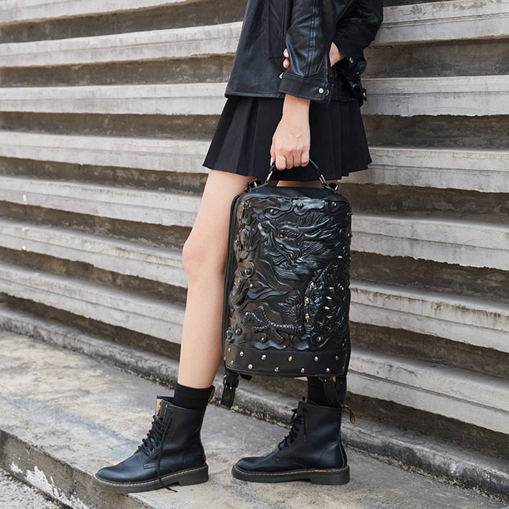 Rossie Viren 3D Dragon messenger backpack featuring a double hovering dragon design on a cylindrical bag with adjustable straps.