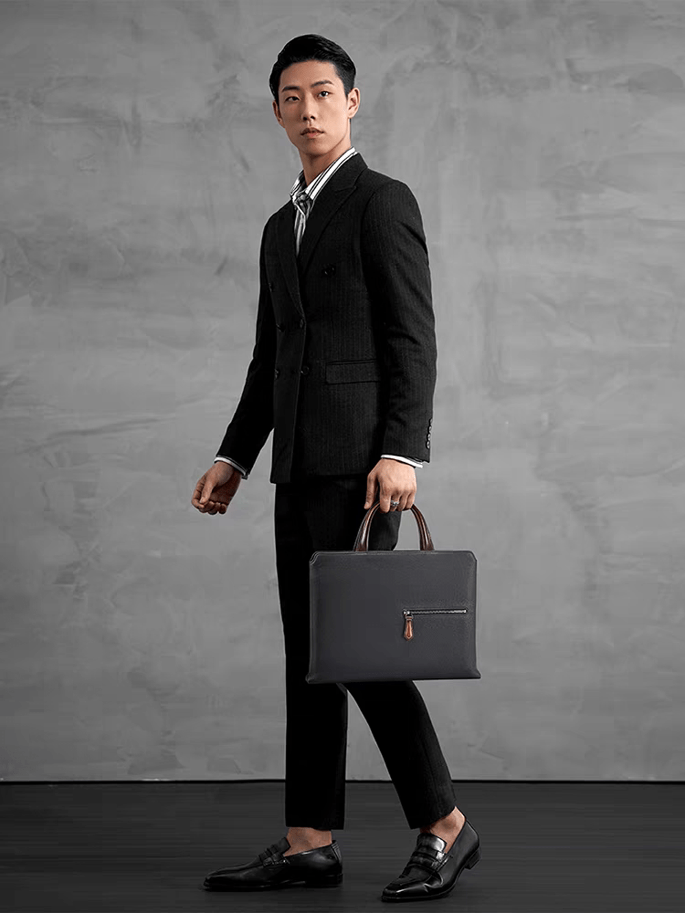 Black 14-inch imported grainy leather Rossie Viren laptop briefcase handbag with classic design and sturdy handle.