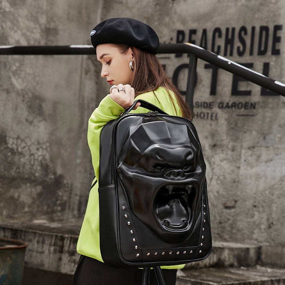 Unisex 3D skull and King Kong backpack with studs, large capacity laptop backpack by Rossie Viren, featuring bold design and multiple compartments.