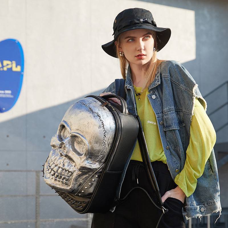Rossie Viren unisex 3D skull backpack featuring a smiling skull design, studded accents, large volume, and laptop compartment.