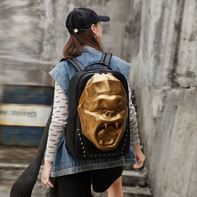 Unisex 3D skull and King Kong backpack with studs, large volume laptop backpack by Rossie Viren, featuring bold graphic design.