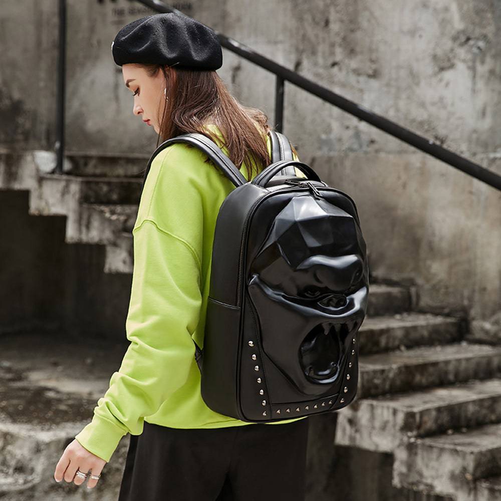Unisex 3D skull and Angry King Kong backpack by Rossie Viren, featuring studded design and large volume for laptops.