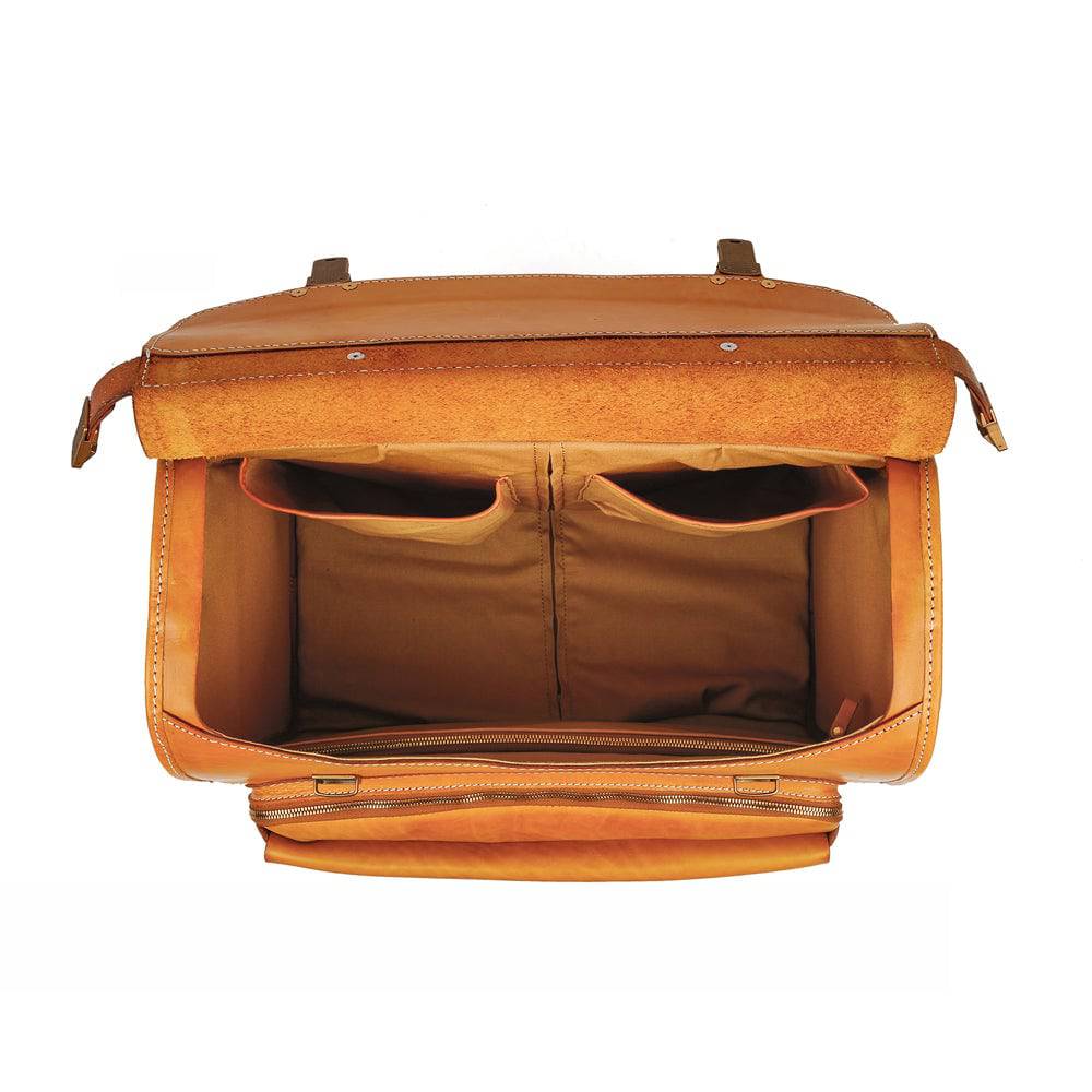 Vintage 20-inch vegetable tanned leather carry-on rolling suitcase by Rossie Viren with spinner wheels in camel color.