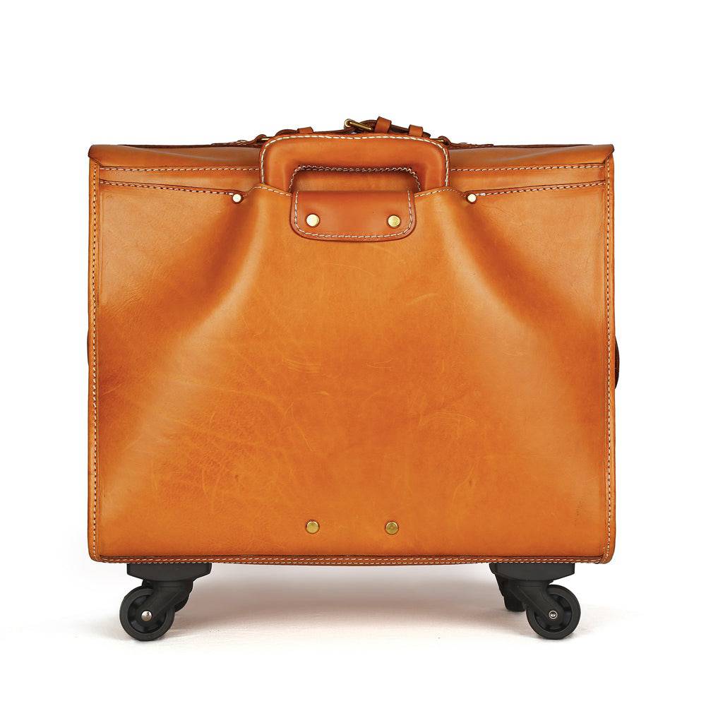 Vintage 20-inch vegetable tanned leather carry-on rolling suitcase by Rossie Viren, with spinner wheels and classic design.