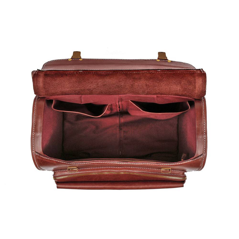 Vintage Rossie Viren 20-inch vegetable tanned leather carry-on rolling suitcase with universal spinner wheels in brown.