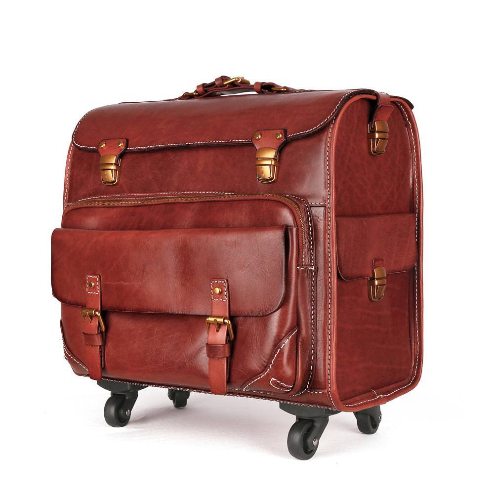 Vintage vegetable tanned leather carry-on rolling suitcase by Rossie Viren with spinner wheels, brown vintage leather luggage.