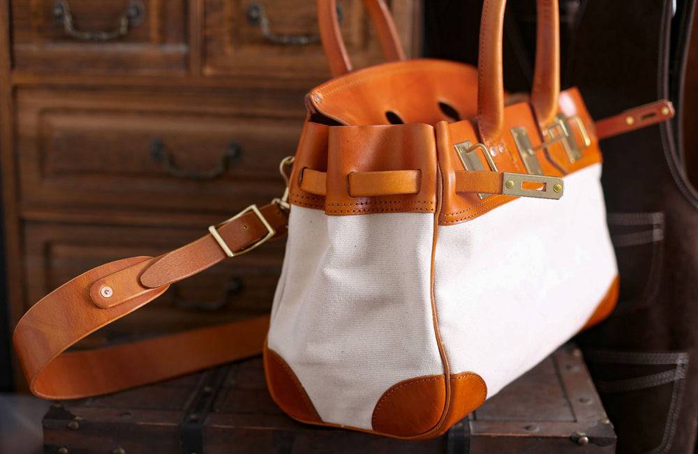 Unisex vintage oil wax leather top handle canvas bag by Rossie Viren showing large capacity, top handles, and rugged design.