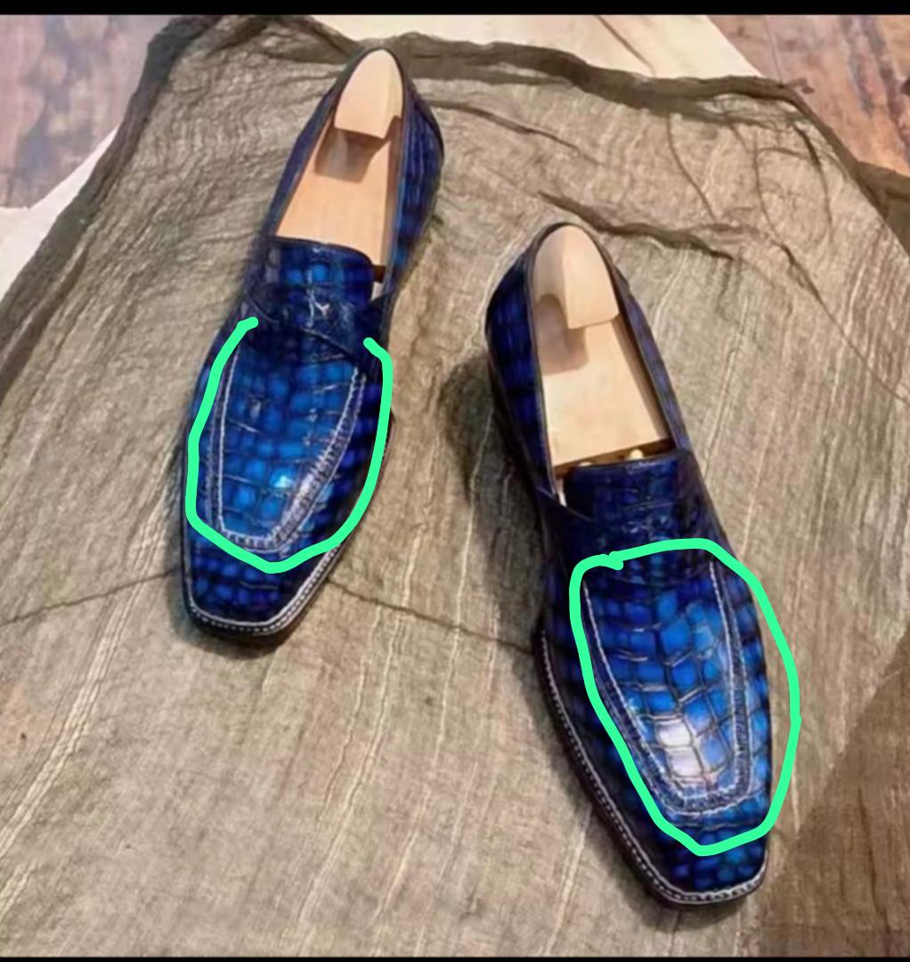 Black crocodile leather dress loafers with Norwegian sewn construction by Rossie Viren, showcasing the detailed crocodile texture.