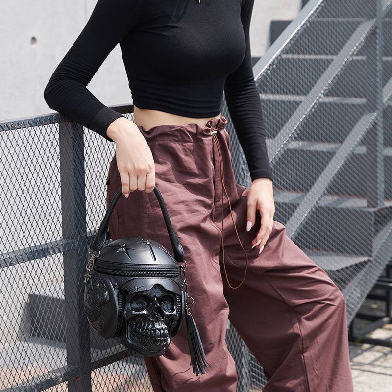 Rossie Viren 3D Skull cross body bag featuring a helmet, earphones, and handle design for a stylish, edgy look.
