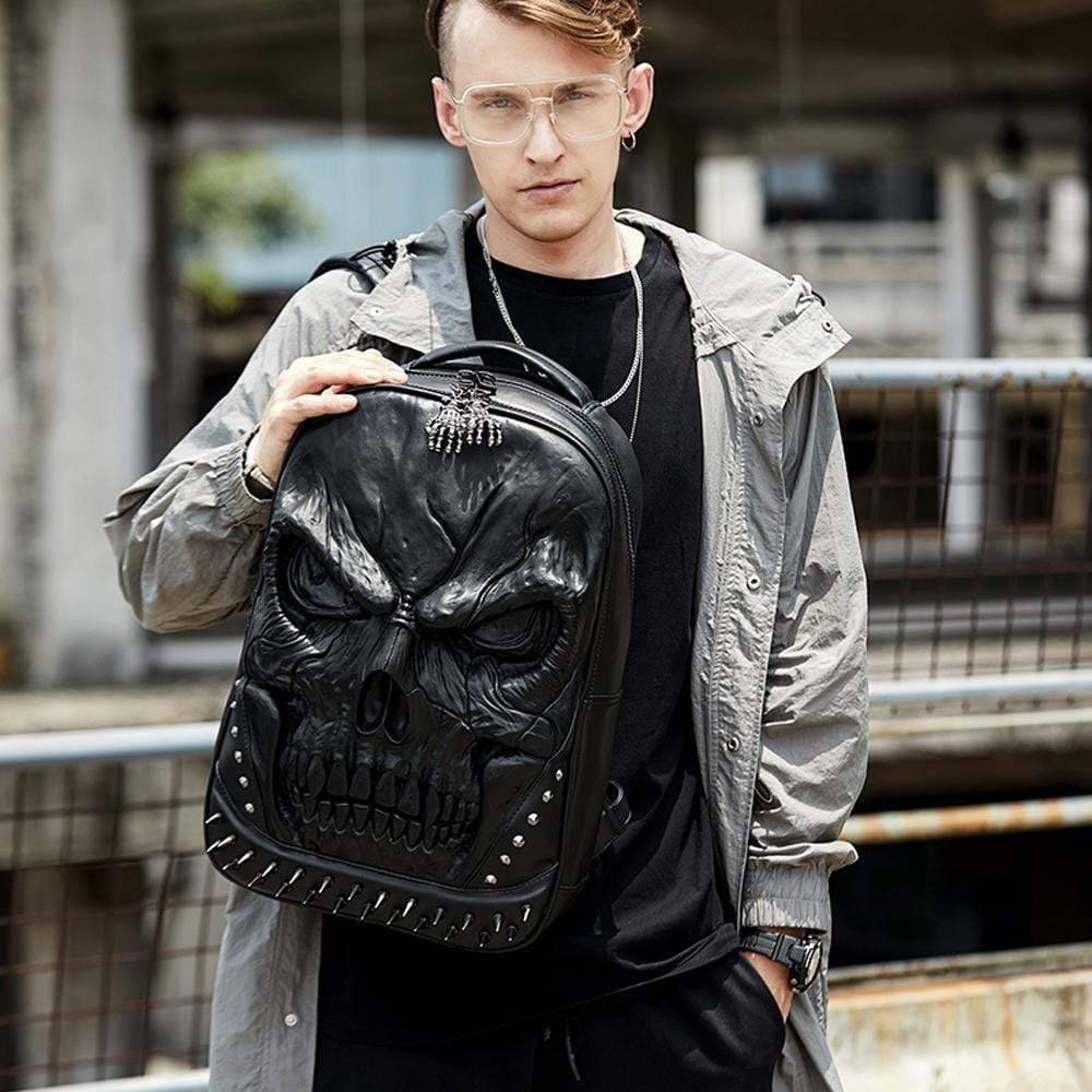 Large 3D skull face waterproof backpack by Rossie Viren, featuring rivet details, suitable for students and casual use.