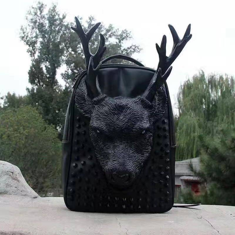 Rossie Viren 3D cow head studded backpack with textured details and adjustable straps, perfect for fashion-forward use.