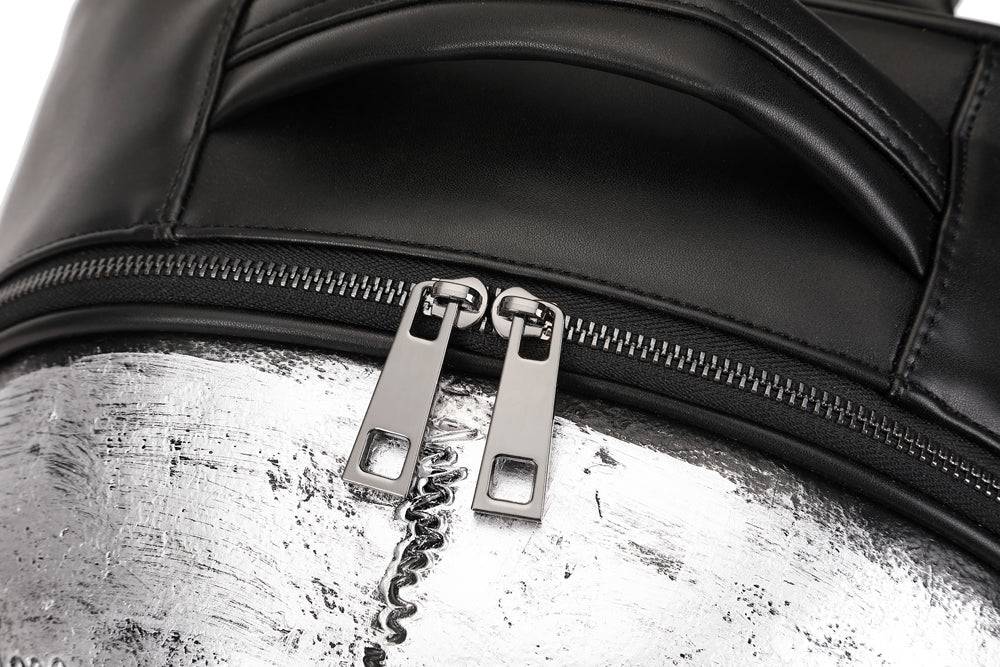 Rossie Viren 3D studded skull backpack featuring bold design with multiple compartments and adjustable straps.
