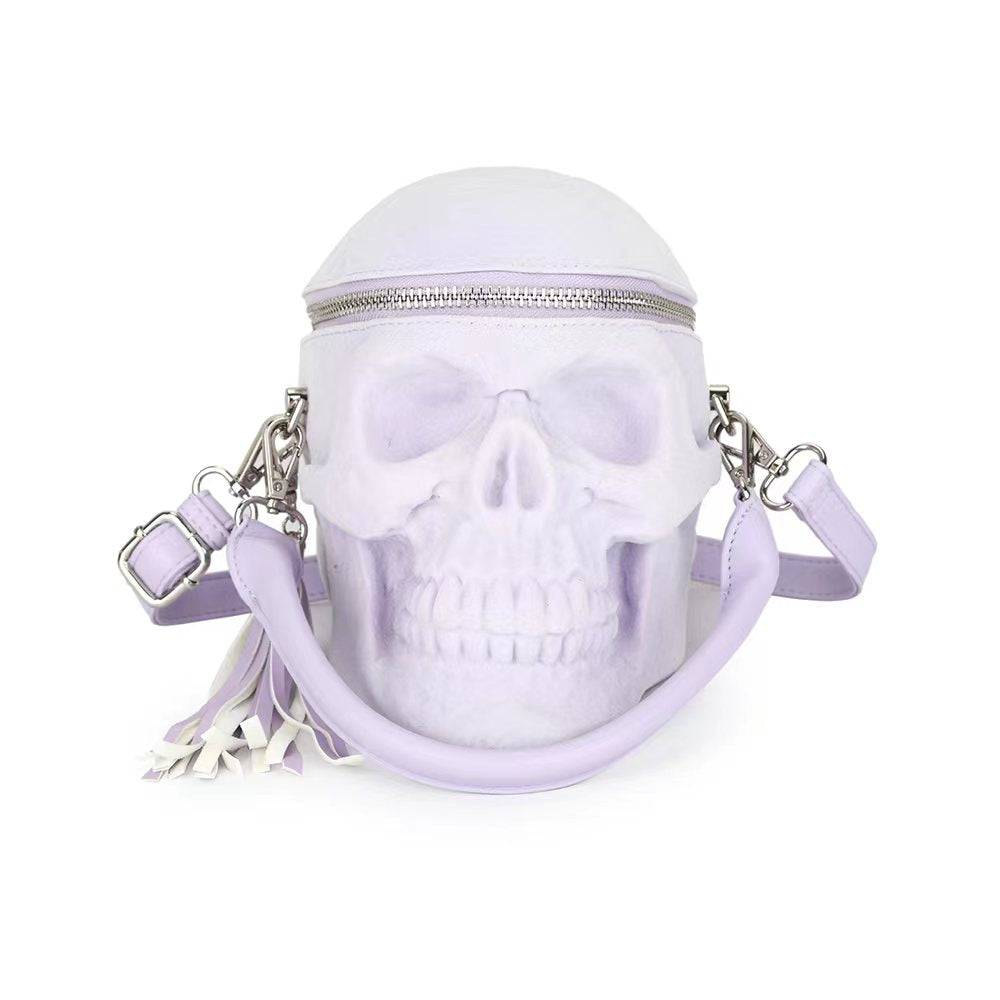 Lilac suede 3D skull crossbody handle bag by Rossie Viren, compact design with mini handle and shoulder strap.