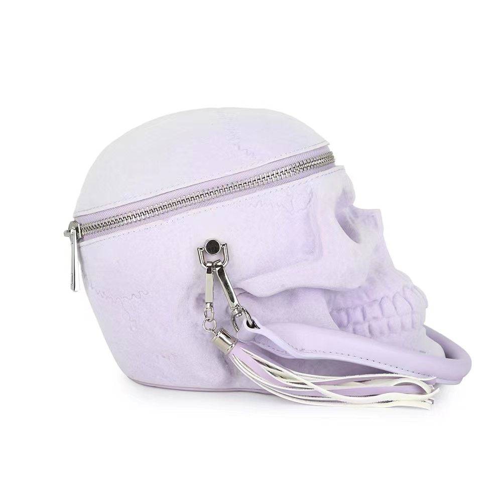 Lilac suede 3D skull crossbody handle bag by Rossie Viren, compact shoulder handbag with mini handle and stylish design.