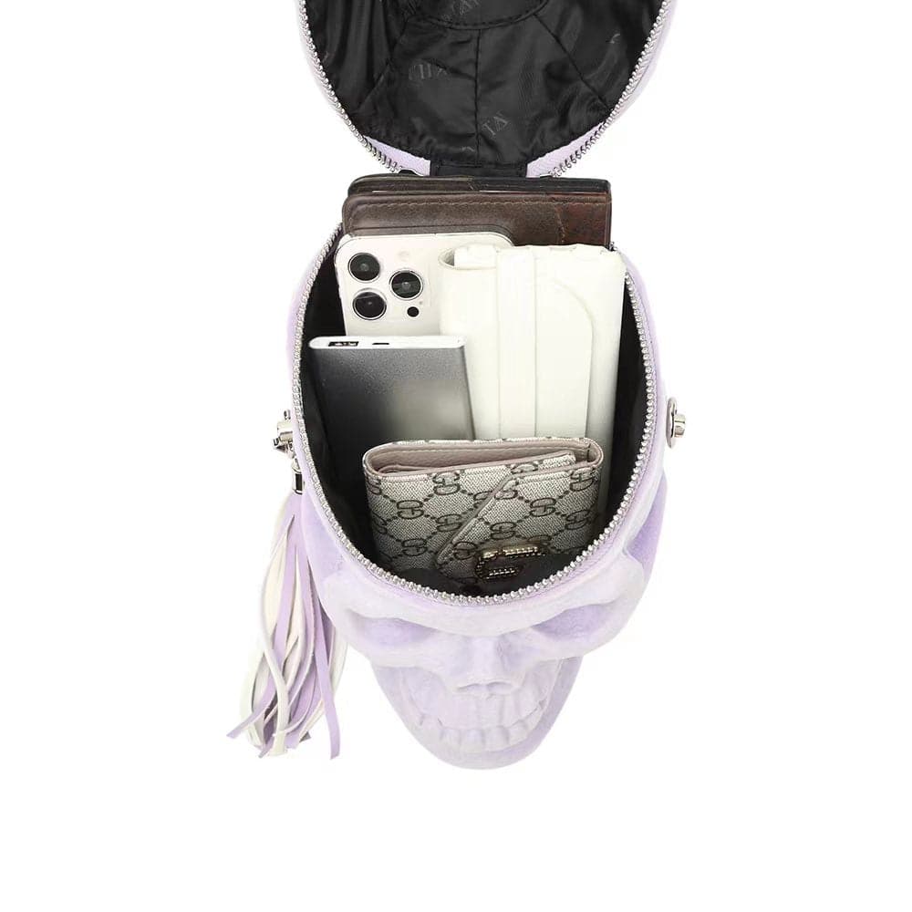 Lilac suede skull crossbody handle bag by Rossie Viren, compact shoulder bag with mini handle and stylish 3D skull design.