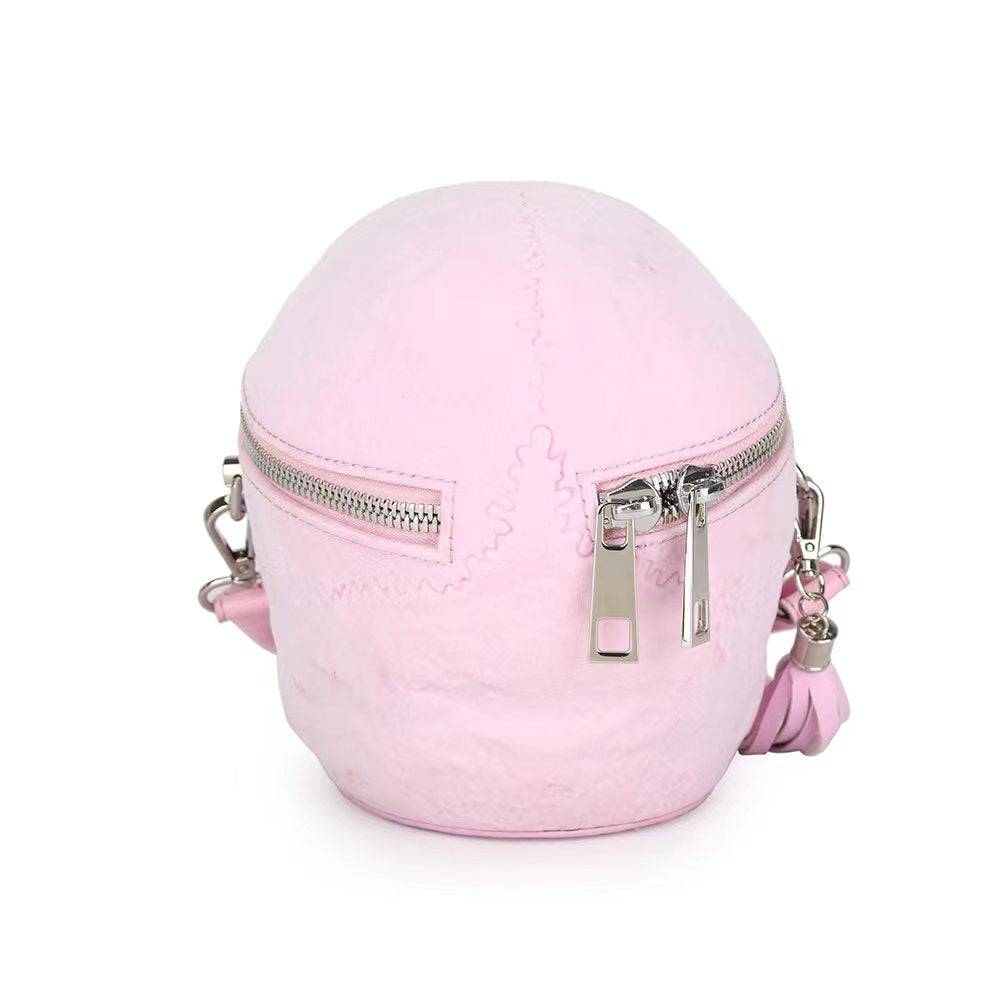 Pink suede 3D skull crossbody handle bag by Rossie Viren, compact with a mini handle, stylish and eye-catching.
