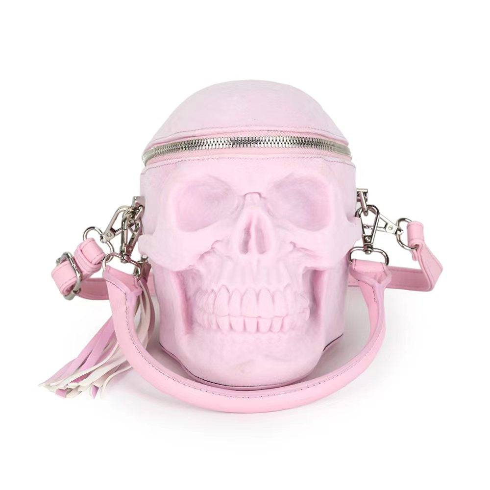 Pink suede 3D skull crossbody handle bag by Rossie Viren, small handbag with mini handle and stylish design.