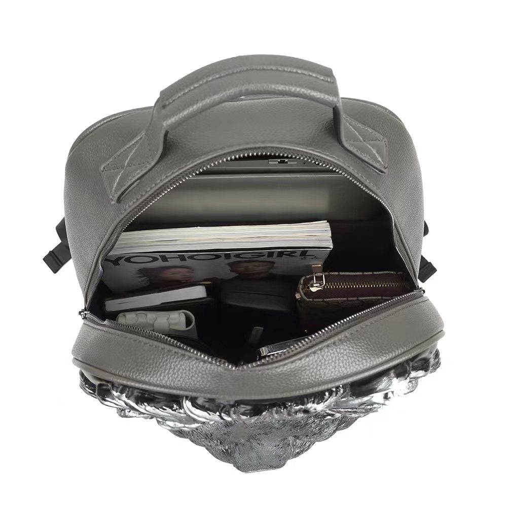 Rossie Viren 3D Lion Studded Flat Backpack made of soft PU leather, featuring a bold lion design, perfect for travel and laptop storage.