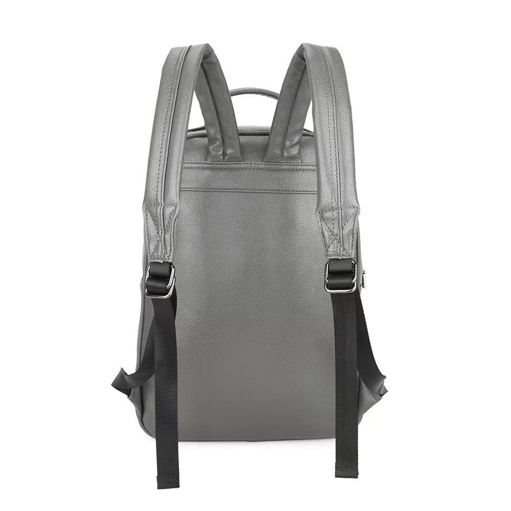 Rossie Viren 3D lion studded flat backpack made of soft PU leather, featuring a travel punk style and laptop compartment.