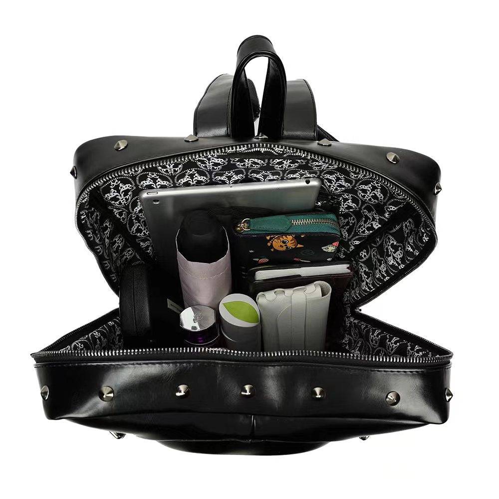 3D skull design backpack by Rossie Viren with rivet studs, black PU leather, suitable for travel, school, and laptop storage.