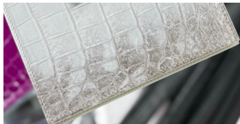 Rossie Viren crocodile skin leather belt in natural tan, showcasing textured crocodile pattern and sleek buckle detail.