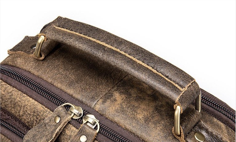 Rossie Viren vintage crossbody handbag with two front pockets, grab handle, and adjustable long shoulder strap.