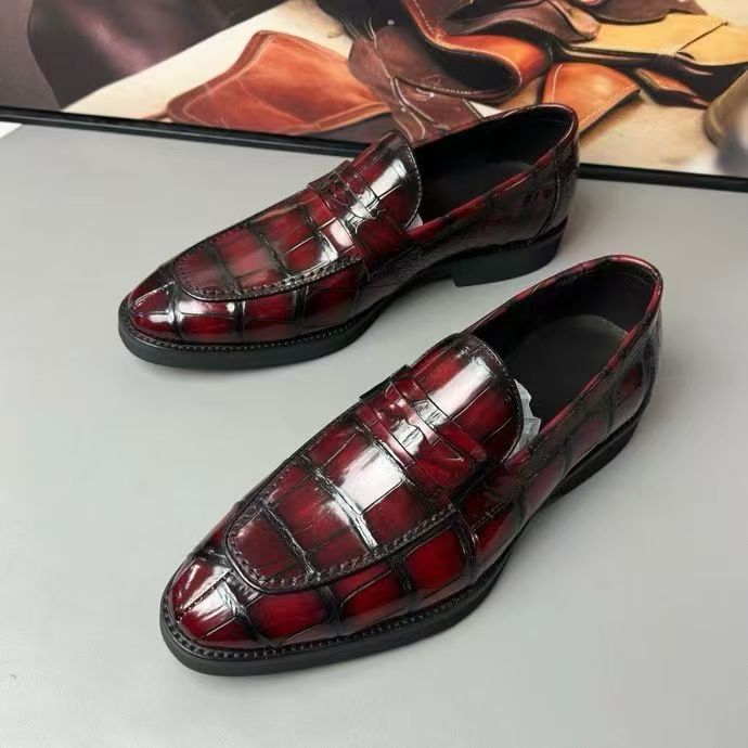 Vintage red crocodile leather loafer shoes by Rossie Viren, showcasing textured crocodile pattern and classic slip-on style.
