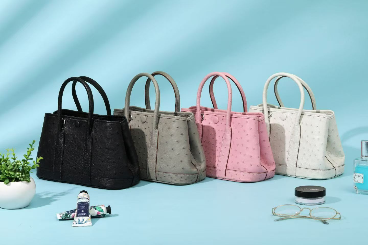 Genuine ostrich skin leather small tote bag by Rossie Viren, stylish handbag with textured black finish and sturdy handles.