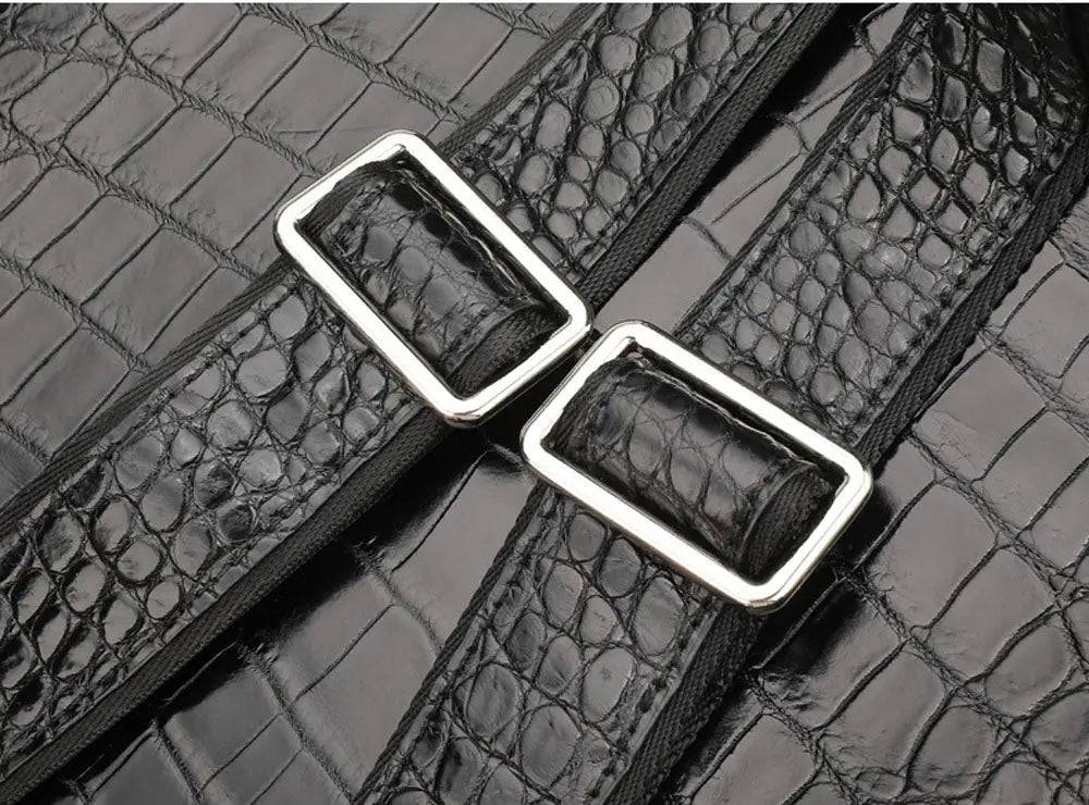 Black crocodile leather backpack by Rossie Viren featuring a sleek design and sturdy straps.