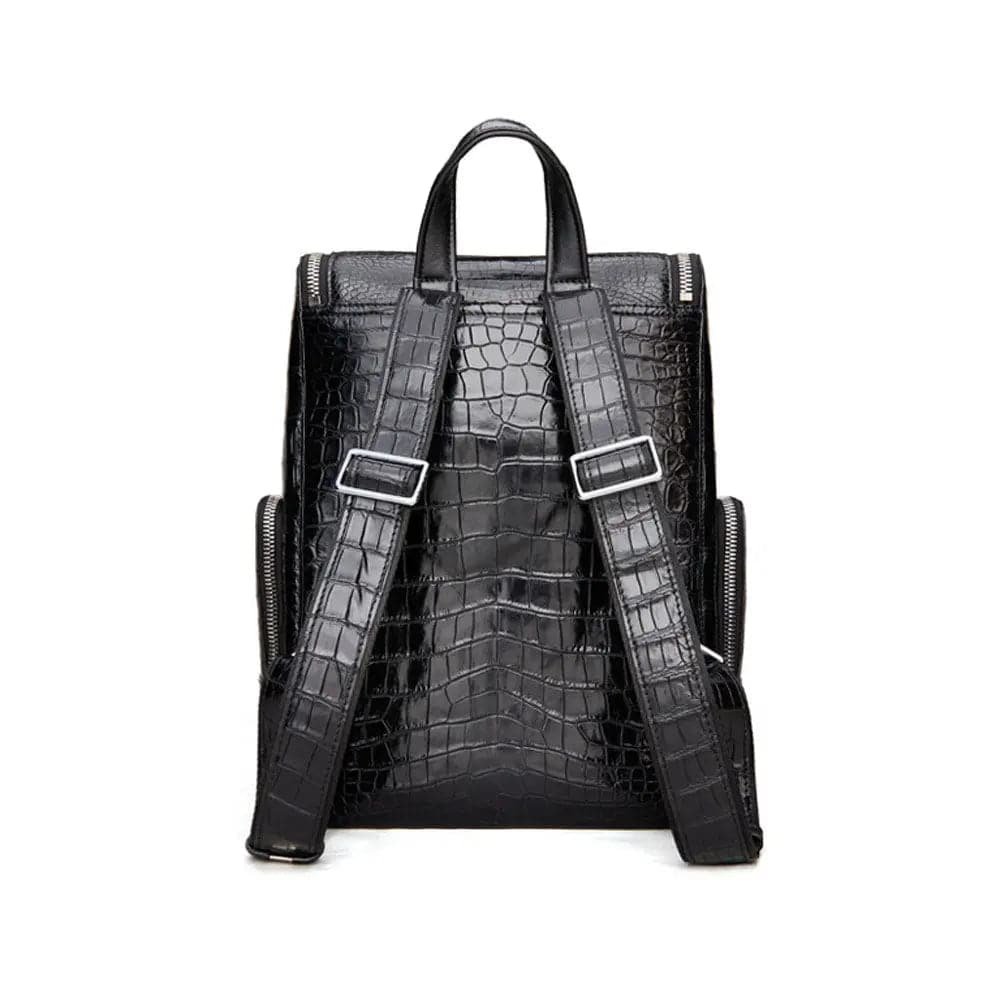 Black crocodile leather backpack by Rossie Viren with sturdy straps and a sleek, textured surface for stylish everyday use.