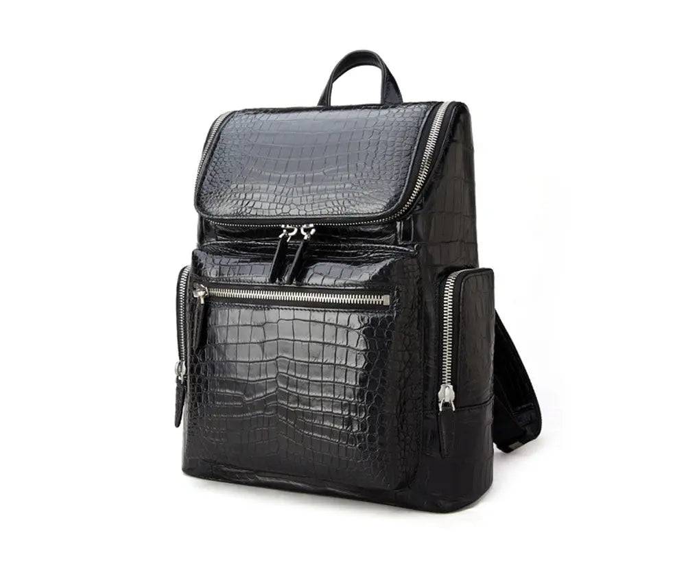 Black crocodile leather backpack by Rossie Viren showing textured crocodile pattern, sturdy straps, and spacious main compartment.
