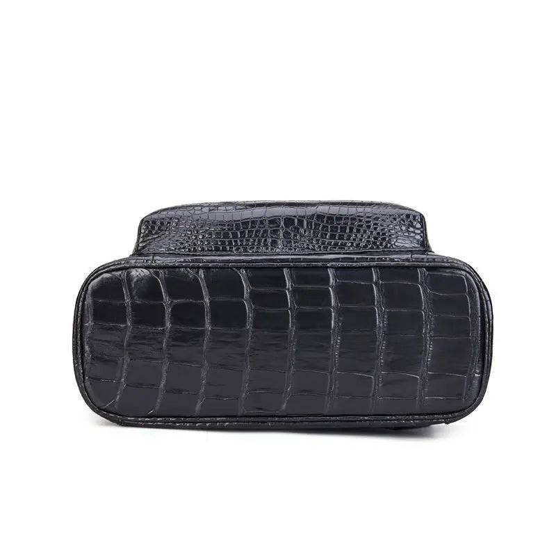 Black crocodile leather backpack by Rossie Viren with sturdy straps and textured finish, stylish for everyday use.