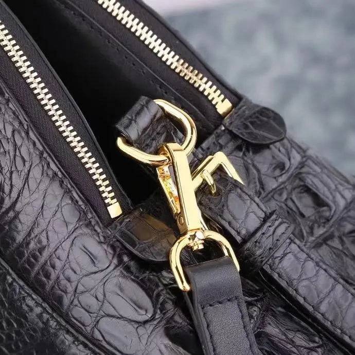 Black crocodile leather briefcase by Rossie Viren, shell style crocodile leather handbag with textured reptile pattern.