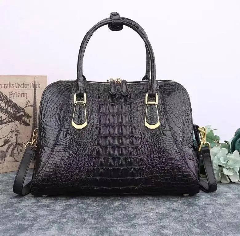 Black crocodile leather briefcase by Rossie Viren, shell style handbag with textured crocodile pattern and sturdy handle.