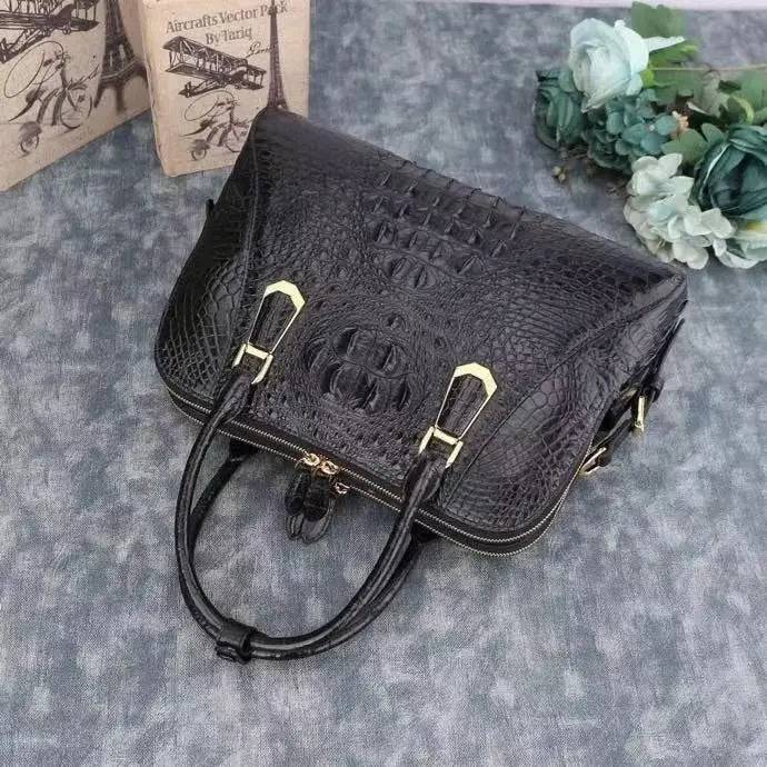 Black crocodile leather briefcase by Rossie Viren, shell style handbag with textured crocodile pattern and sturdy handle.